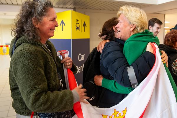 Jersey airport arrivals hall. Two of the rowers of Team Intrepid 232 return to the island following Atlantic 2024 and setting a new world record for the oldest women's fours crew to complete the challenge.         Rosemary Satchwell, Alison Smithurst, Julie Brady and Helene Monpetit finished the 3,000-mile rowing race in 58 days, 12 hours and 30 minutes, the 10th boat in the Women’s Class and 28th in all boats.   Alison Smithurst on right welcomed by friends                                Picture: ROB CURRIE