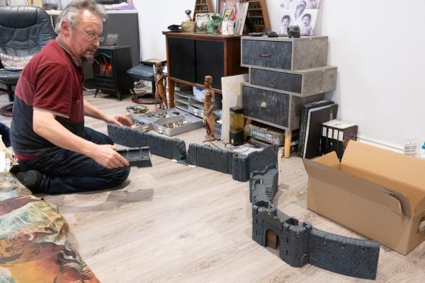 Mark De Gruchy, who takes part in War Gaming. His preferred genres are Napoleonic, World War II and Lord of the Rings. After finishing the making of the wall outside of Helms Deer, in the Lord of the Rings, Mark checks the pieces fit together                   Picture: ROB CURRIE