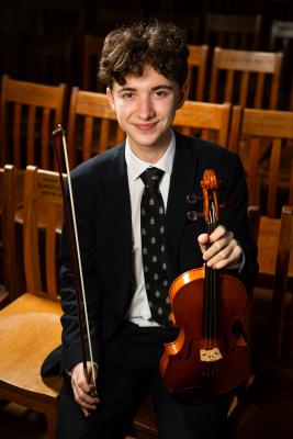 Victoria College, Great Hall. Ed Clark (16) with his violin, strings finalist in the Young Musician of the Year competition YMOTY 2024                         Picture: ROB CURRIE