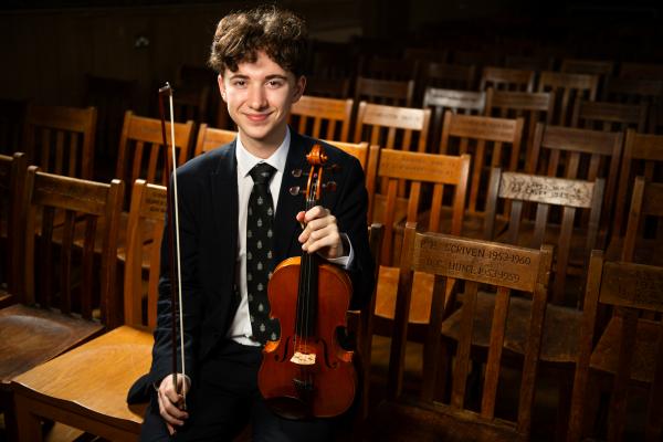 Victoria College, Great Hall. Ed Clark (16) with his violin, strings finalist in the Young Musician of the Year competition YMOTY 2024                         Picture: ROB CURRIE