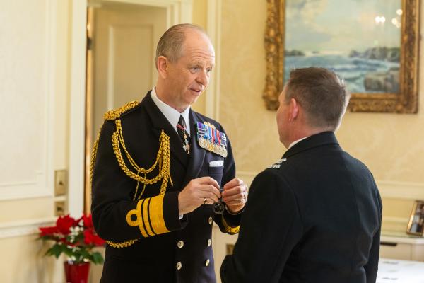 Government House. Medal Presentation to the States of Jersey Police. L>R Vice Admiral Jerry Kyd, Governor of Jersey and Const Scott Docherty - LS&GC Medal                            Picture: ROB CURRIE