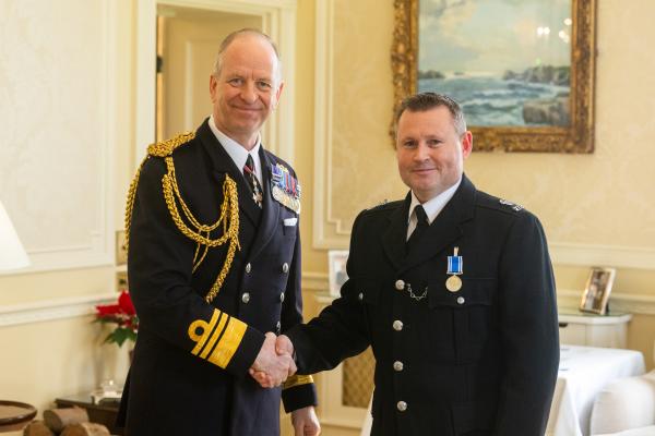 Government House. Medal Presentation to the States of Jersey Police. L>R Vice Admiral Jerry Kyd, Governor of Jersey and Const Scott Docherty - LS&GC Medal                            Picture: ROB CURRIE