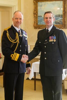 Government House. Medal Presentation to the States of Jersey Police. L>R Vice Admiral Jerry Kyd, Governor of Jersey and Det Ch Inspr Craig Jackson - LS&GC Medal                            Picture: ROB CURRIE