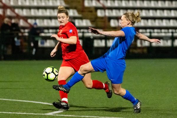 Football at Springfield. Jersey FA Women (blue) vs Army FA Women (red). L>R Courtney Jones and Jodie Botterill has a shot at goal                          Picture: ROB CURRIE