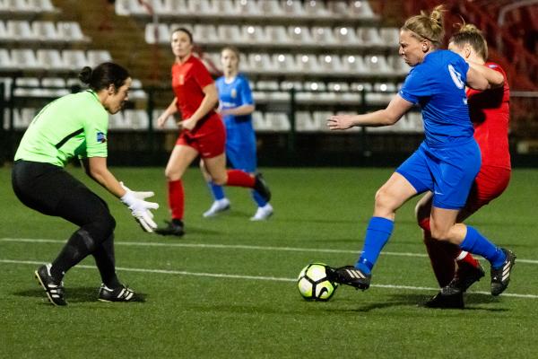 Football at Springfield. Jersey FA Women (blue) vs Army FA Women (red). L>R Daisy Burnfield, Jodie Botterill has a shot at goal and Courtney Jones                         Picture: ROB CURRIE