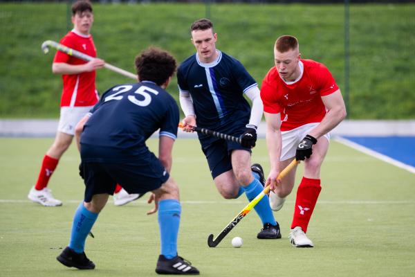 Hockey at Les Quennevais. Jersey (red) V Woking (blue). Jamie Watling                                   Picture: ROB CURRIE