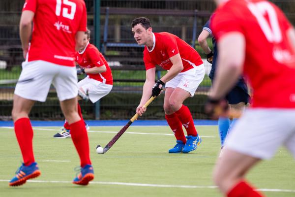 Hockey at Les Quennevais. Jersey (red) V Woking (blue). Peter Millar                                   Picture: ROB CURRIE