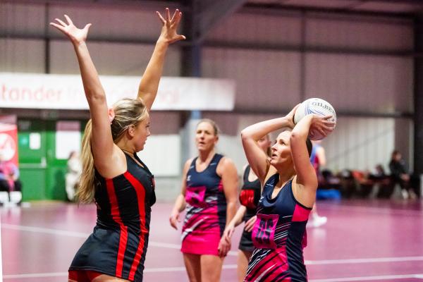Netball at Les Ormes. St Lawrence A (purple) V St Clement A (black). L>R Cerys O'Connell and Rena Nelson                                  Picture: ROB CURRIE