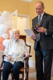The Lieutenant Governor Jerry Kyd reading a birthday card from the King and Queen to Hazel Tadier on her 100th birthday at Glanville Home Picture: MATTHEW HOTTON