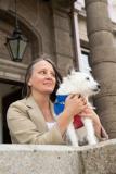 Julie Daly-Wallman with her dog Buttons outside the States building. She was sworn in as a Roads Inspector and Buttons was allowed in the Royal Court as it is her support for autism and anxiety. Picture: JON GUEGAN