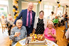 St Ewolds Care Home  celebrating its 30th Birthday with a party for staff, residents and family members. Sitting L>R Jim and Clare Pallett, a married couple who live at the home with standing L>R Simon Crowcroft, constable of St Helier and his wife Angela with the special birthday cake                Picture: ROB CURRIE