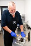 The Smokey Shed. Owner Neil Cotillard who makes Biltong and Smoked salmon. Assistant Mick Rondel cutting Biltong prior to packaging                      Picture: ROB CURRIE