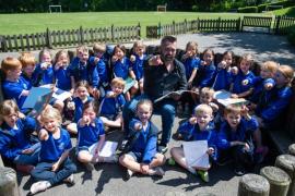 UK Children's Poet Ian Bland with pupils from Mont Nicolle school  Picture: JON GUEGAN