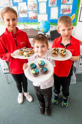 JCP school. Using as many Fairtrade ingredients as possible - such as chocolate, bananas, cocoa powder, honey, syrup and sugar – can you bake some show-stopping cupcakes?

Get baking over the weekend and bring your celebratory cupcakes into school on Monday 11th March!

At 12 noon, Head chef at Longueville Manor - Andrew Baird, Chairman of the Jersey Fairtrade Group and head chef at the Longueville Manor Hotel – Tony Allchurch BEM and Carl Winn – Head of Community & Sustainability for the The Channel Islands Co-operative Society - will be sampling and judging their favourite Fairtrade cupcake – based on appearance, creativity and taste! Winners L>R Imogen (9), George (5) and Adam (6)                           Picture: ROB CURRIE