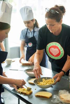 St Brelades Bay hotel. Mont Nicolle pupils  participating in an Hospitality Experience / Nutrition Education Programme with Caring Cooks. Mixing & shaping scones onto trays to be baked in kitchen and
filling & cutting finger sandwiches. Rachel Higo of Caring Cooks                        Picture: ROB CURRIE
