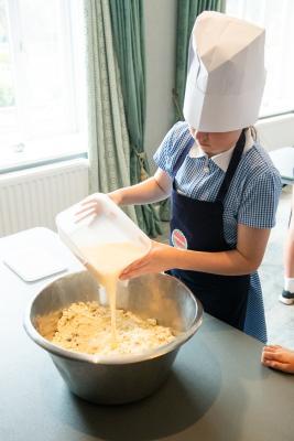 St Brelades Bay hotel. Mont Nicolle pupils  participating in an Hospitality Experience / Nutrition Education Programme with Caring Cooks. Mixing & shaping scones onto trays to be baked in kitchen and
filling & cutting finger sandwiches. Mixing the scone ingredients                        Picture: ROB CURRIE