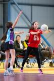 Netball at Les Ormes. Jersey U11 (red) vs Blundell’s prep school (blue) from Tiverton in Devon.  Amelia Gaudin       Picture: ROB CURRIE
