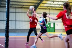 Netball at Les Ormes. Jersey U11 (red) vs Blundell’s prep school (blue) from Tiverton in Devon.  Amelia Gaudin      Picture: ROB CURRIE