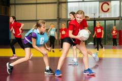Netball at Les Ormes. Jersey U11 (red) vs Blundell’s prep school (blue) from Tiverton in Devon.  L>R Eliza Griffiths and Winnie Young      Picture: ROB CURRIE