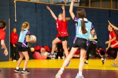 Netball at Les Ormes. Jersey U11 (red) vs Blundell’s prep school (blue) from Tiverton in Devon.  L>R Eliza Griffiths and Winnie Young      Picture: ROB CURRIE