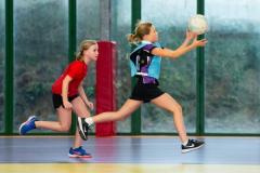 Netball at Les Ormes. Jersey U11 (red) vs Blundell’s prep school (blue) from Tiverton in Devon.  L>R Winnie Young and Eliza Griffiths       Picture: ROB CURRIE