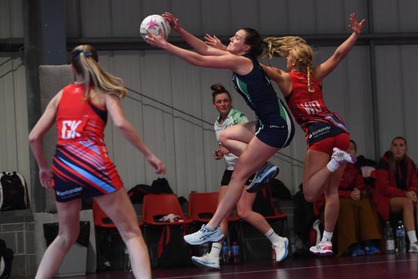 Poole's Centre Abi Robson contests with Jets Nicole Goddard NETBALL Team Jets v Poole Picture: DAVID FERGUSON