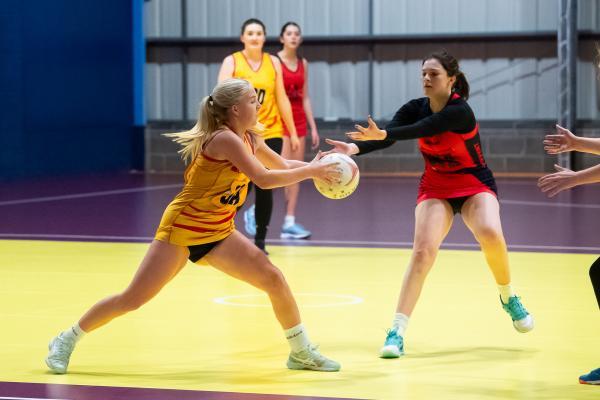 Netball at Les Ormes. St Saviour A (yellow) V Convent C (red). L>R Trinity Smith and Abbie Inman                      Picture: ROB CURRIE