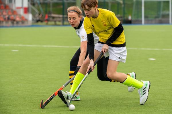 Hockey at Les Quennevais. Quakers (white) V Walkers Dragons (yellow). L>R Gemma Minty (nee Sutton) and Beau Johnstone-Scott                             Picture: ROB CURRIE