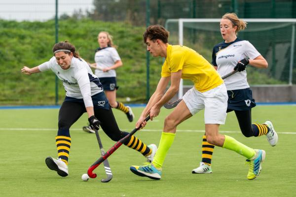 Hockey at Les Quennevais. Quakers (white) V Walkers Dragons (yellow). L>R Jamey Henderson (nee Herbert) and Issac Cotillard                             Picture: ROB CURRIE