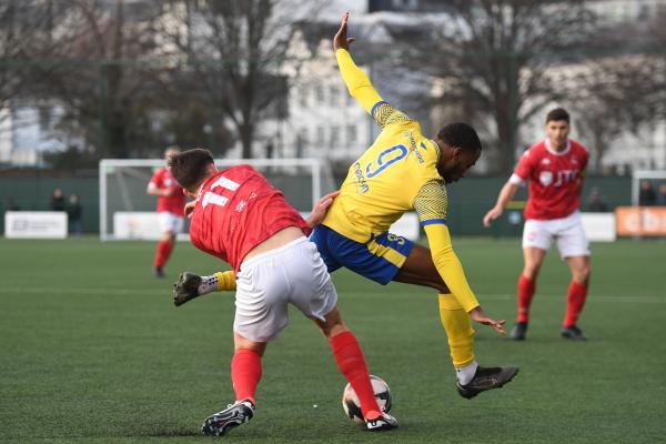 Jonny Le Quesne and Tyrese Sutherland FOOTBALL Jersey Bulls v Redhill Picture: DAVID FERGUSON