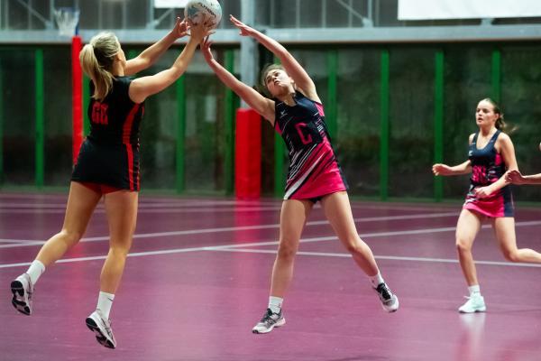 Netball at Les Ormes. St Lawrence B (purple) V St Clement A (black). L>R  Cerys O'Connell and Steph Egan                                Picture: ROB CURRIE