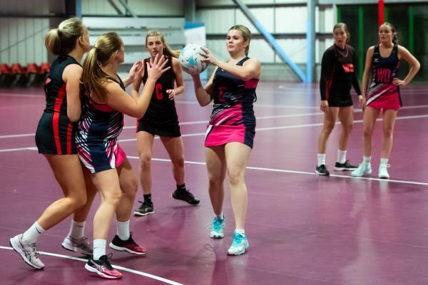 Netball at Les Ormes. St Lawrence B (purple) V St Clement A (black). Grace Butler with ball                                  Picture: ROB CURRIE