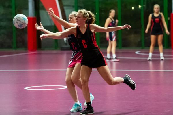 Netball at Les Ormes. St Lawrence B (purple) V St Clement A (black). L>R Grace Butler and Ellie Thackeray                                 Picture: ROB CURRIE