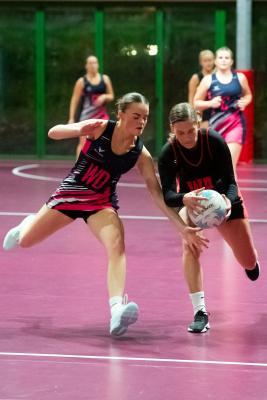 Netball at Les Ormes. St Lawrence B (purple) V St Clement A (black). L>R  Scarlett Sargeant and Amber Cox                                Picture: ROB CURRIE