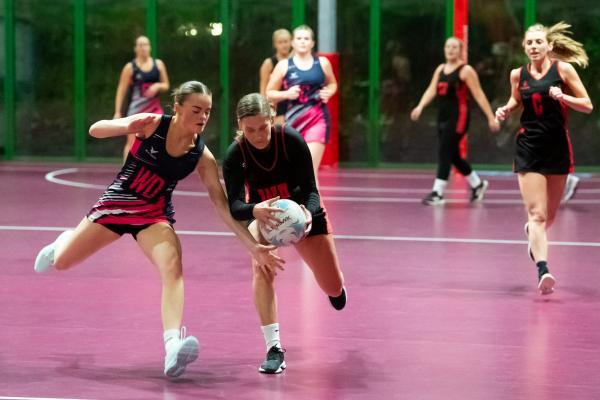 Netball at Les Ormes. St Lawrence B (purple) V St Clement A (black). L>R  Scarlett Sargeant and Amber Cox                                Picture: ROB CURRIE