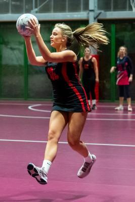 Netball at Les Ormes. St Lawrence B (purple) V St Clement A (black). Cerys O'Connell         Picture: ROB CURRIE