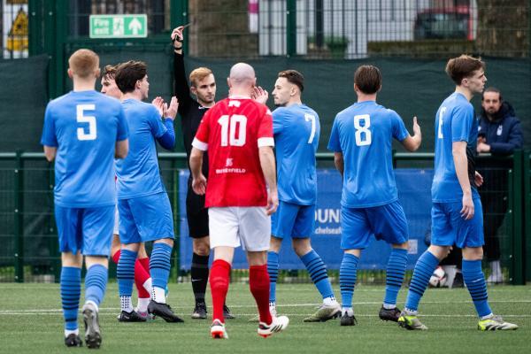 Football at Springfield. Jersey Bulls (red) V Colliers Wood (blue). Harry Curtis receives a red card in the opening seconds of the game                        Picture: ROB CURRIE