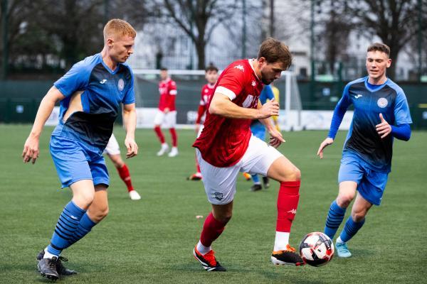 Football at Springfield. Jersey Bulls (red) V Colliers Wood (blue). L>R Tom Blampied and Lorne Bickley                            Picture: ROB CURRIE