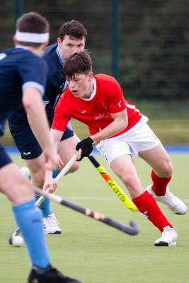 Hockey at Les Quennevais. Jersey (red) V Woking (blue). Sam Watling                                    Picture: ROB CURRIE
