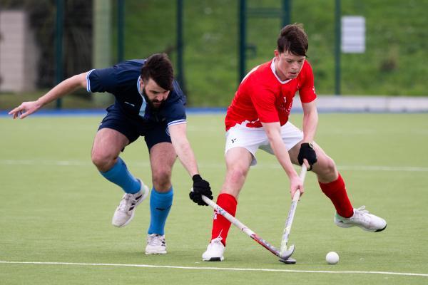 Hockey at Les Quennevais. Jersey (red) V Woking (blue). Sam Watling on right                                   Picture: ROB CURRIE