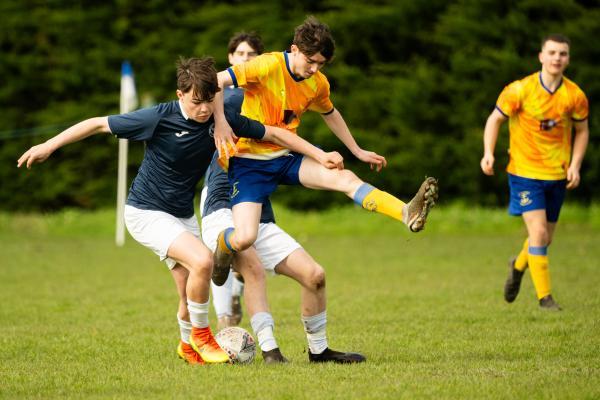 Football at Le Couvent. The Tregear Junior Memorial Trophy (U18): Rozel Rovers (blue) v St Clement (yellow). L>R Joe Racjan, Liam Brennan and Charlie Blair                    Picture: ROB CURRIE