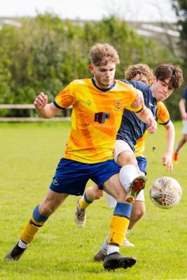 Football at Le Couvent. The Tregear Junior Memorial Trophy (U18): Rozel Rovers (blue) v St Clement (yellow). L>R Shea Richards and Leo Coehlo                    Picture: ROB CURRIE