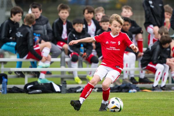 Football at FB Fields. Jersey Primary schools football festival. Jersey A (red) V Gloucester A (black). L>R Teijo Boletta                            Picture: ROB CURRIE