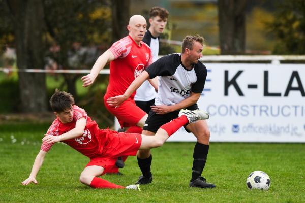 Jamie Mourant breaking the tackle FOOTBALL Wanderers v St Brelade Picture: DAVID FERGUSON