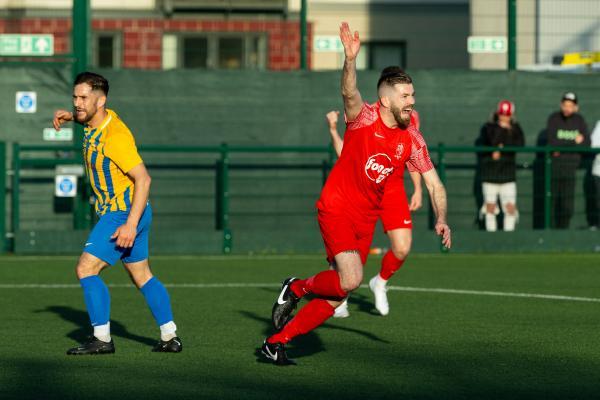 Football at Springfield. Jersey FA Cup final: Madeira (yellow) V St Brelade (red). Kris McAdam celebrates scoring the first goal for St Brelade                      Picture: ROB CURRIE
