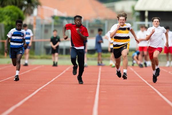 Athletics at the track at FB Fields. Schools athletics cup - boys year 7/8 & 9/10. 100m. L>R Dennis Musaba (12) (red shirt) of Grainville (came fourth I think) and Harry Glynn (13) (white shirt black/yellow hoops) of Victoria College won                        Picture: ROB CURRIE