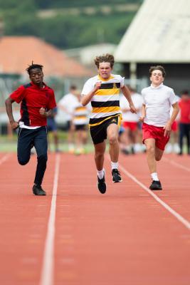 Athletics at the track at FB Fields. Schools athletics cup - boys year 7/8 & 9/10. 100m. L>R Dennis Musaba (12) (red shirt) of Grainville (came fourth I think) and Harry Glynn (13) (white shirt black/yellow hoops) of Victoria College won                        Picture: ROB CURRIE