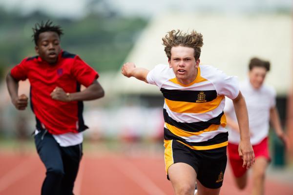 Athletics at the track at FB Fields. Schools athletics cup - boys year 7/8 & 9/10. 100m. L>R Dennis Musaba (12) (red shirt) of Grainville (came fourth I think) and Harry Glynn (13) (white shirt black/yellow hoops) of Victoria College dipping for the finish line and won                        Picture: ROB CURRIE