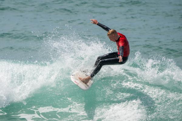 Surfing, St Ouen's Bay, Watersplash. Round 1 of 4 of the Jersey Surfboard Club junior division summer series. Red vest Arran Hunt (16)                                  Picture: ROB CURRIE