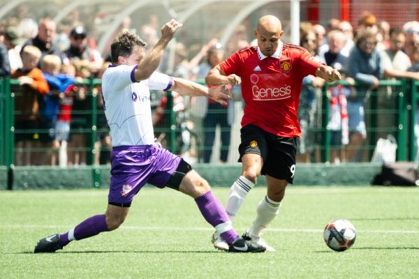 Football at Springfield.  Jersey Bulls select XI (white) V Manchester United Legends side (red). L>R Kevan Nelson and Danny Webber                 Picture: ROB CURRIE